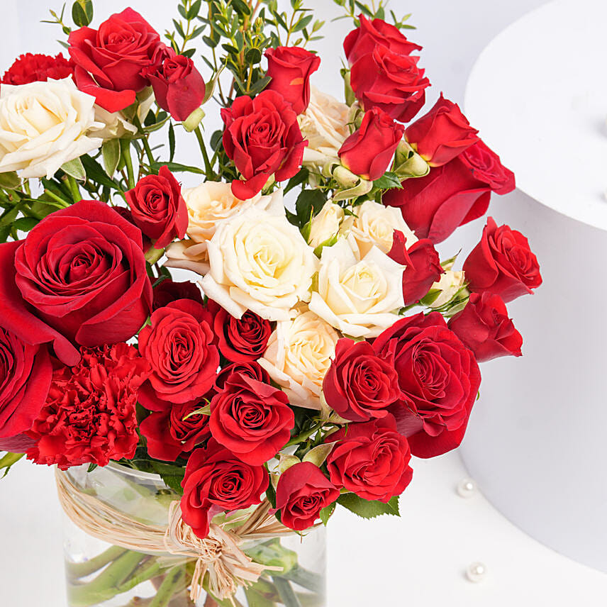 Red and Peach Roses in a Vase